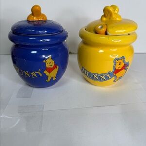 Disney Winnie the Pooh Ceramic Hunny Pots. Yellow pot comes with a dipper. Set